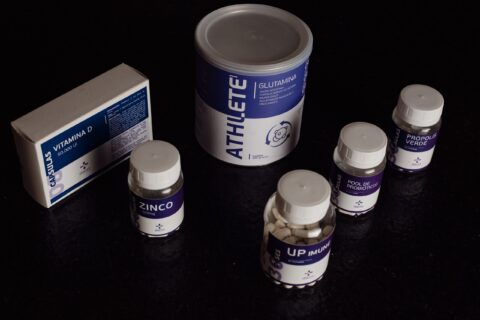 Close-up of a variety of nutritional supplements, vitamins, and probiotics.